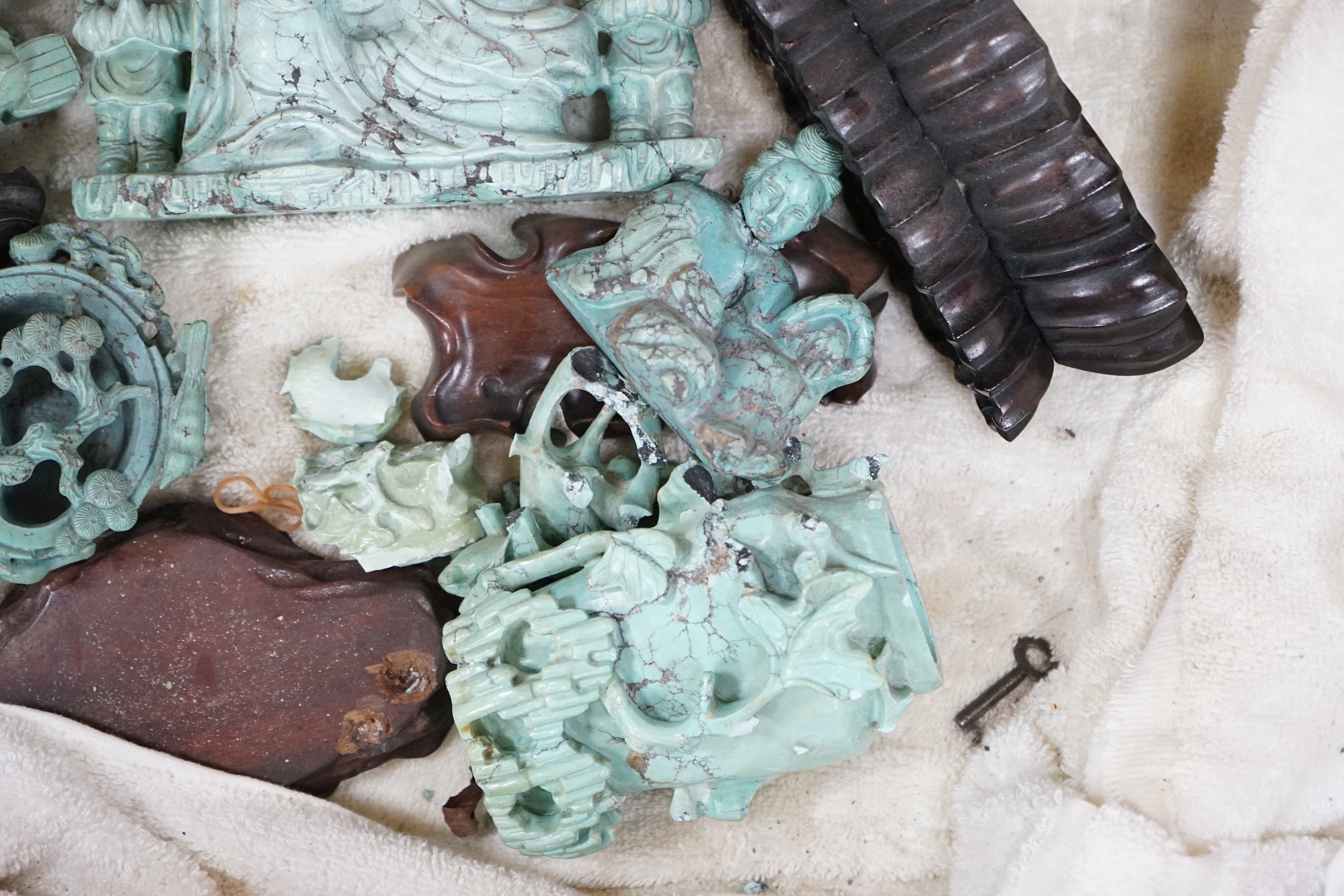 A group of Chinese turquoise matrix carvings, comprising a boy on a buffalo, 5.5in. a brushwasher, 7in. a vase and cover, 6.5in. a snuff bottle and a figure of a woman, 4.5in. (all a.f.)